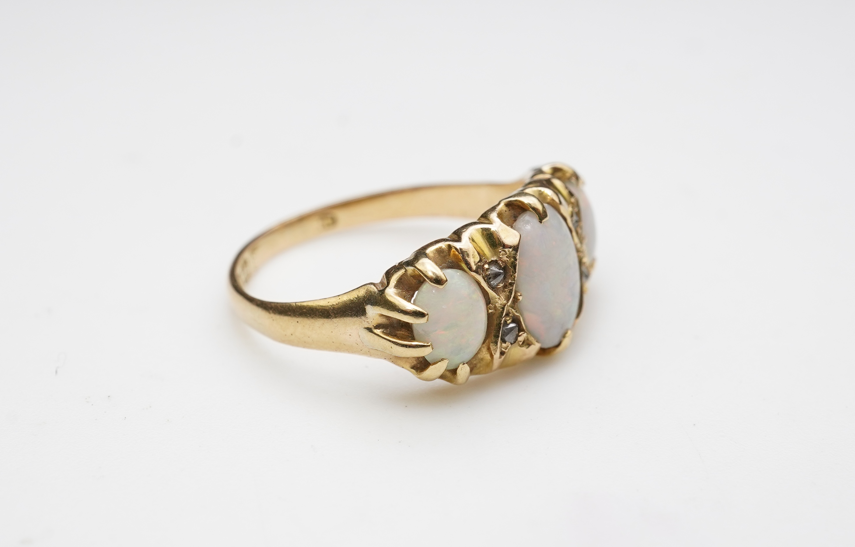 A Victorian 18ct gold and opal ring, circa 1898